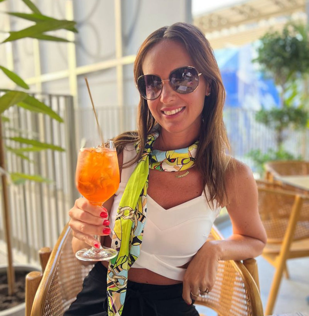 Veronika P. wearing a One by One silk scarf